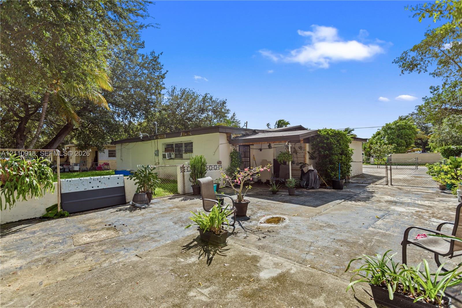 Exterior area featuring a concrete patio, a covere