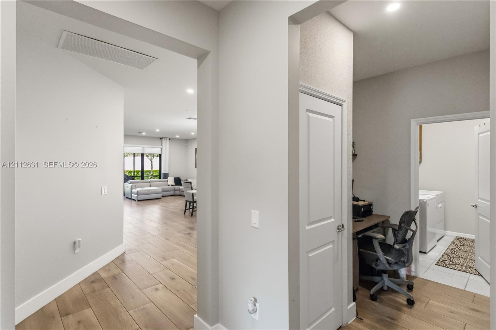 Interior featuring wood-finish flooring, recessed