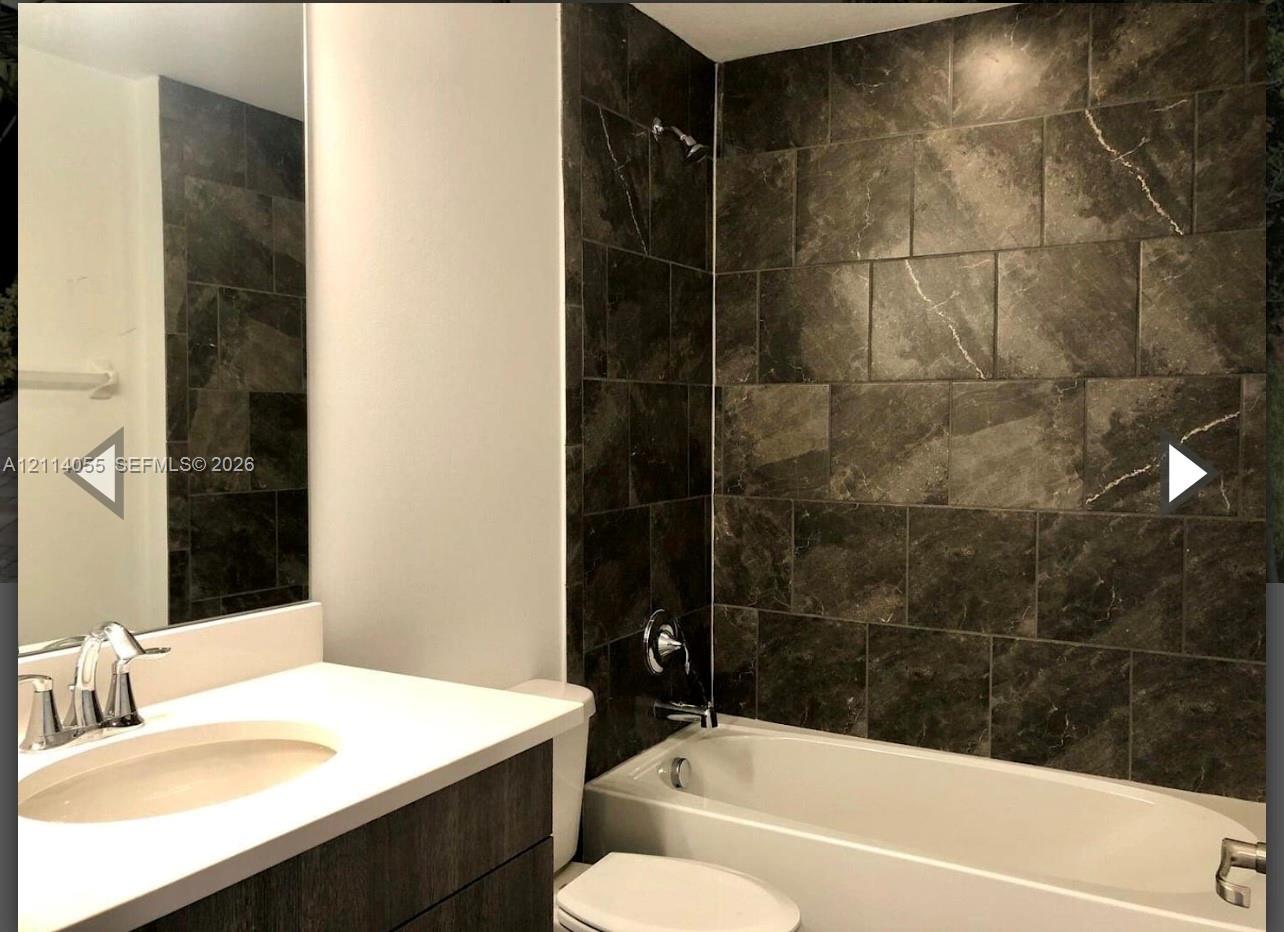 Bathroom featuring a vanity with white countertop,