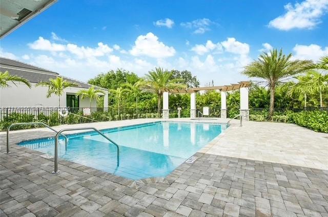 In-ground swimming pool with built-in stairs, surr